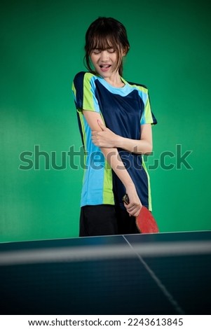 Female ping pong player injured arm muscle during ping pong match