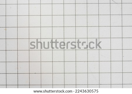 texture of white squared sheet of paper, piece of white checkered exercise book without notes Royalty-Free Stock Photo #2243630575