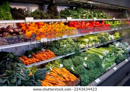 A view of a fresh vegetable display at a local grocery store. Royalty-Free Stock Photo #2243634423