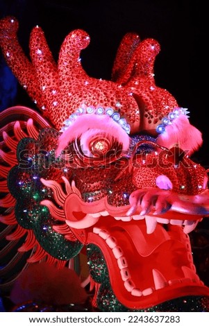 
close-up photo of Large Chinese dragon puppet head It is a popular show during the Chinese New Year.