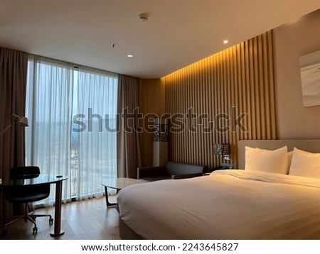 Clean and tidy empty hotel room Royalty-Free Stock Photo #2243645827