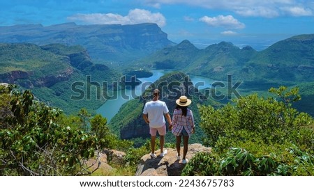 Panorama Route South Africa, Blyde river canyon with the three rondavels, view of three rondavels and the Asian women and Caucasian men on vacation in South Africa Royalty-Free Stock Photo #2243675783