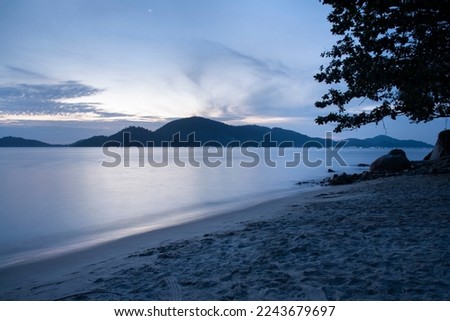 slow exposure shot at the late evening sky at the beach. Royalty-Free Stock Photo #2243679697