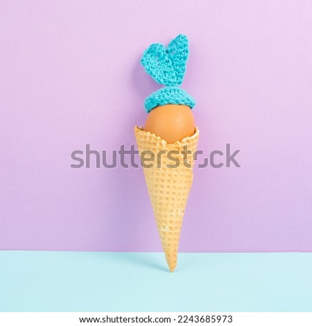 Cute easter bunny or rabbit with an egg face in an ice cream cone, spring holiday, greeting card 