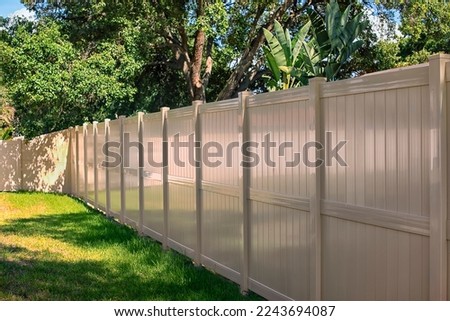 Solid Privacy 8 Foot Vinyl Fence Tan Color Royalty-Free Stock Photo #2243694087