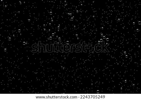 Bubble texture isolated on black background for compositing. Close-up photo. Royalty-Free Stock Photo #2243705249