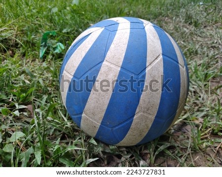 Blue white ball on a children's playing field