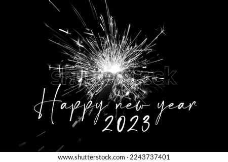 Happy new year 2023 white sparkler new years eve countdown. Luxury entertainment celebration turn of the year party time. Premium nightlife visual with glowing light sparks on dark background