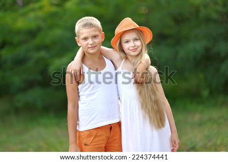 Portrait of a boy and girl in summer