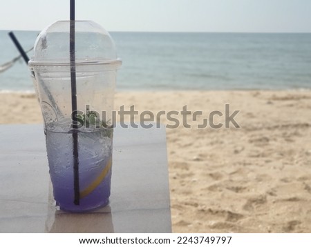 Cool butterfly pea flower water with hot weather by the sea. 