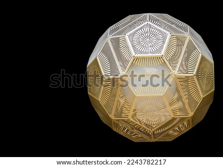 Mid-century hanging  light fixture - gold metal cutout - octagon shape on black background -room for copy Royalty-Free Stock Photo #2243782217