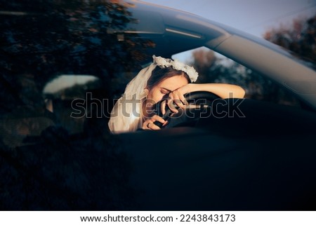 
Exhausted anxious Bride Crying Behind Steering Wheel. Upset married woman having an accident on her wedding day
 Royalty-Free Stock Photo #2243843173