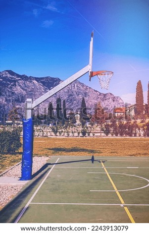 Deserted sports field on the shores of Lake Garda in Italy in faded color effect. Royalty-Free Stock Photo #2243913079