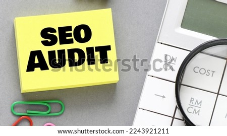 SEO AUDIT words on a small piece of paper.