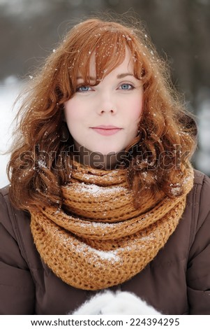  Outdoors portrait of young beautiful woman in winter 