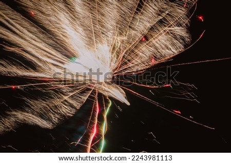 colorful glittering fireworks, black background, isolated