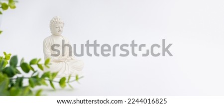 Vesak Day is holy day for Buddhists. Happy Buddha Day with Siddhartha Gautama statue on white background. Mental health and meditation concept. Selective soft focus. Royalty-Free Stock Photo #2244016825