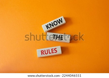 Know the rules symbol. Wooden blocks with words Know the rules. Beautiful orange background. Business and Know the rules concept. Copy space.