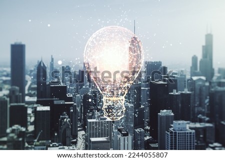 Abstract virtual light bulb hologram on Chicago office buildings background, idea concept. Multiexposure