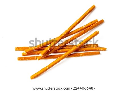 Stick cracker, pretzel, on white background. Crunchy salted pretzel sticks isolated. Royalty-Free Stock Photo #2244066487