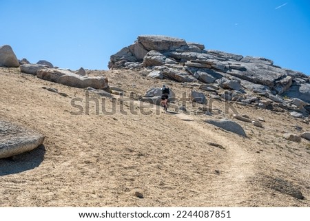 Woman Trudges Up Deep Trail to Alta Peak in Sequoia National Park Royalty-Free Stock Photo #2244087851