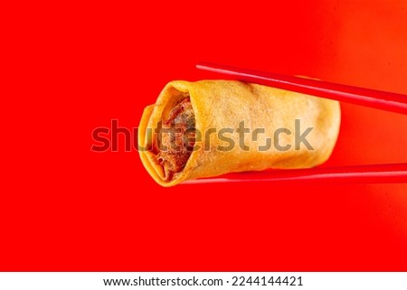 Spring rolls are eaten on Chinese New Year's Day. Spring rolls are a Chinese snack