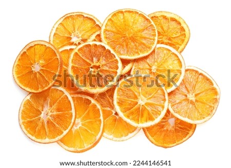 Delicious dry orange slices on white background, top view Royalty-Free Stock Photo #2244146541
