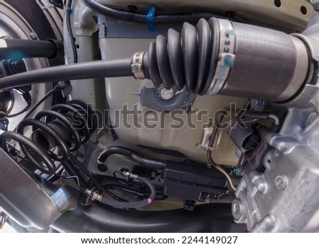 Bottom car view for safety inspection. Concept of garage services, used vehicle appraisal, car points inspection, automobile certification. Checking on shock absorbers damaged and suspension parts. Royalty-Free Stock Photo #2244149027