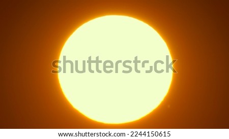 Sunrise in the orange yellow red sky. Epic sun rise as big bright hot disk. Vibrant color background. Sun at summer sky.  Royalty-Free Stock Photo #2244150615
