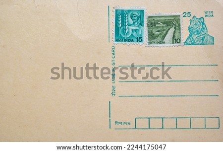 Blank Indian postcard with old stamps ready to fill out. 
