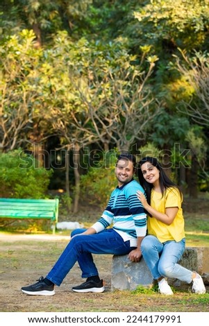 Young indian couple giving expression at park
