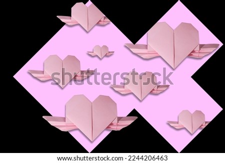 black background with pink part in which there are pink paper hearts, creative holiday design