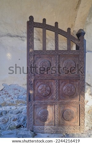 Old wooden gate of a medieval church