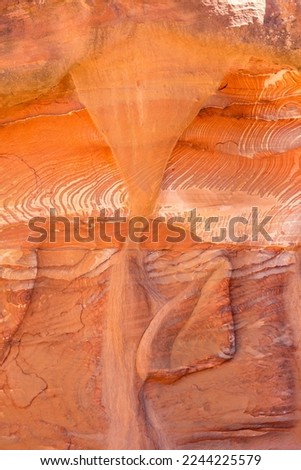 Multi-colored sandstone rock and mineral layers in ancient tombs of Petra, Jordan. Pattern, geological stone texture
