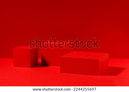 Red scene, red stage for product presentation made with cube shapes. Studio photography.