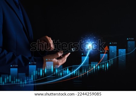 Businessman analysis profitability of working companies with digital augmented reality graphics, positive indicators in marketing , businessman calculates financial data for long term investments. Royalty-Free Stock Photo #2244259085