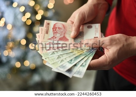 Hands holding pile of money. Serbian dinar paper currency, 500,1000 and 2000 dinars value Royalty-Free Stock Photo #2244260453