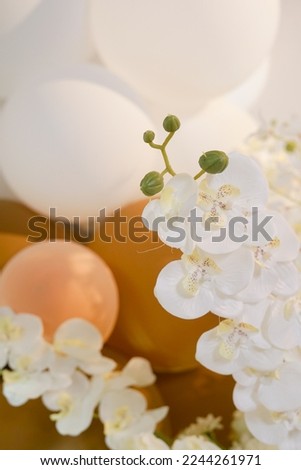 Selected focus photo of artificial white flowers with blurred background