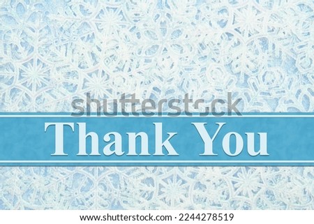 Thank you message with white and blue snowflakes winter on a ribbon