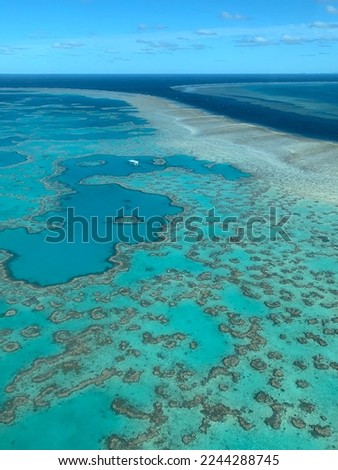 The Great Barrier Reef is the world's largest coral reef system composed of over 2,900 individual reefs and 900 islands and the most beautiful shades of blue