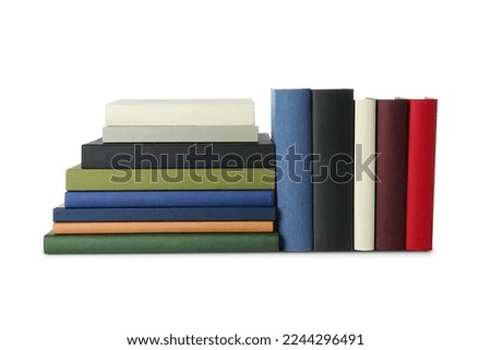 Many different hardcover books on white background