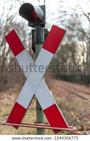 St. Andrew's cross in front of a level crossing
