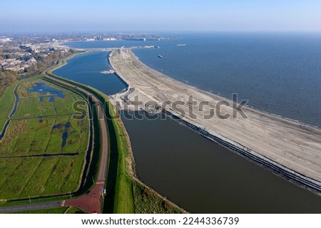 Drone photo of the IJsselmeer near Hoorn, the Netherlands. Here comes a recreational beach and nature reserve they are created with sprayed sand.