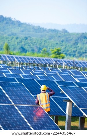 Engineers with solar panels, technician checking solar panels,Engineer or electrician working Royalty-Free Stock Photo #2244356467