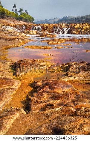 Death and desolation in the Tinto River, Huelva, Spain. As a possible result of the mining, Rio Tinto is notable for being very acidic and its deep reddish hue is due to iron and copper dissolved.