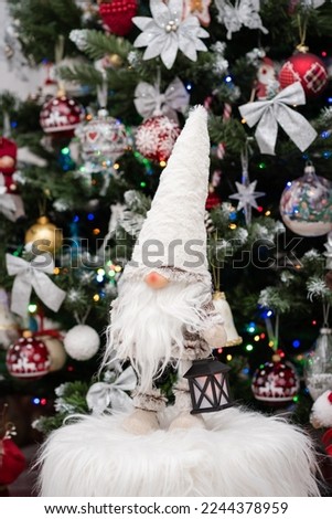 Gnome near the Christmas tree.