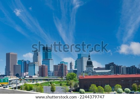 Downtown Minneapolis Skyline , Minnesota Bright Sunny Day  with Blue Sky and White Clouds 
