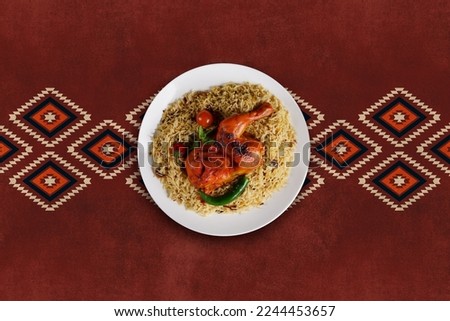 Saudi Arabian dish chicken kabsa with rice mandi, Arabic cuisine Chicken "Kabsa" or Chicken Beryani rice. Royalty-Free Stock Photo #2244453657