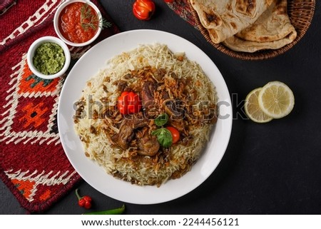 Mandi is a traditional dish from Yemen of meat, rice, and spices. It is now very popular in other areas of the Arabian Peninsula, and it is also common in Egypt and Levant and saudi. Royalty-Free Stock Photo #2244456121