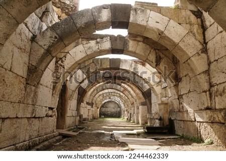 The Agora of Smyrna, known as the "Roman Agora", is the main archaeological site being excavated in the ancient city of Smyrna, present-day Izmir Royalty-Free Stock Photo #2244462339